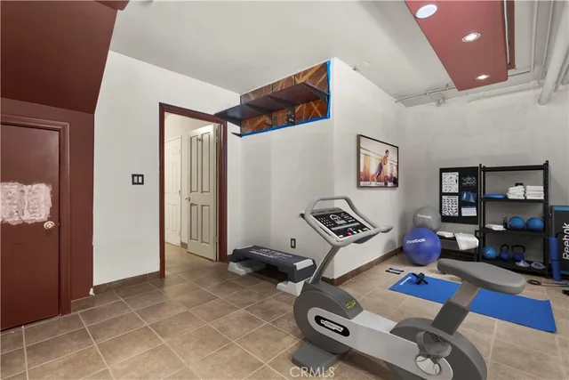 a bedroom with furniture and a book shelf