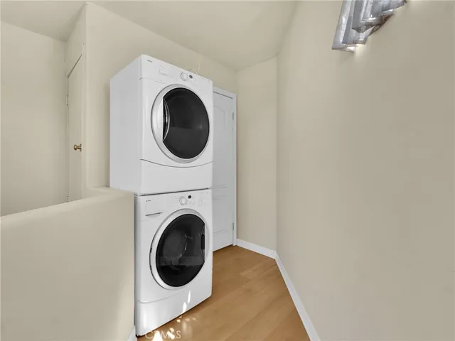 a close view of a utility room with dryer and washer