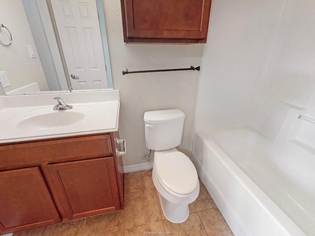 1198 Jones-Butler Road, Unit 2607 College Station, TX 77840 - Photo 18 of 26 a bathroom with a sink a toilet and vanity