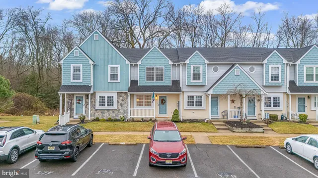 a view of a house with swimming pool and furniture