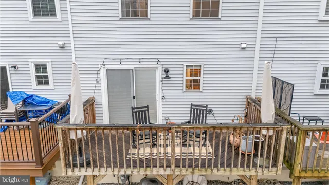 a view of a balcony with furniture