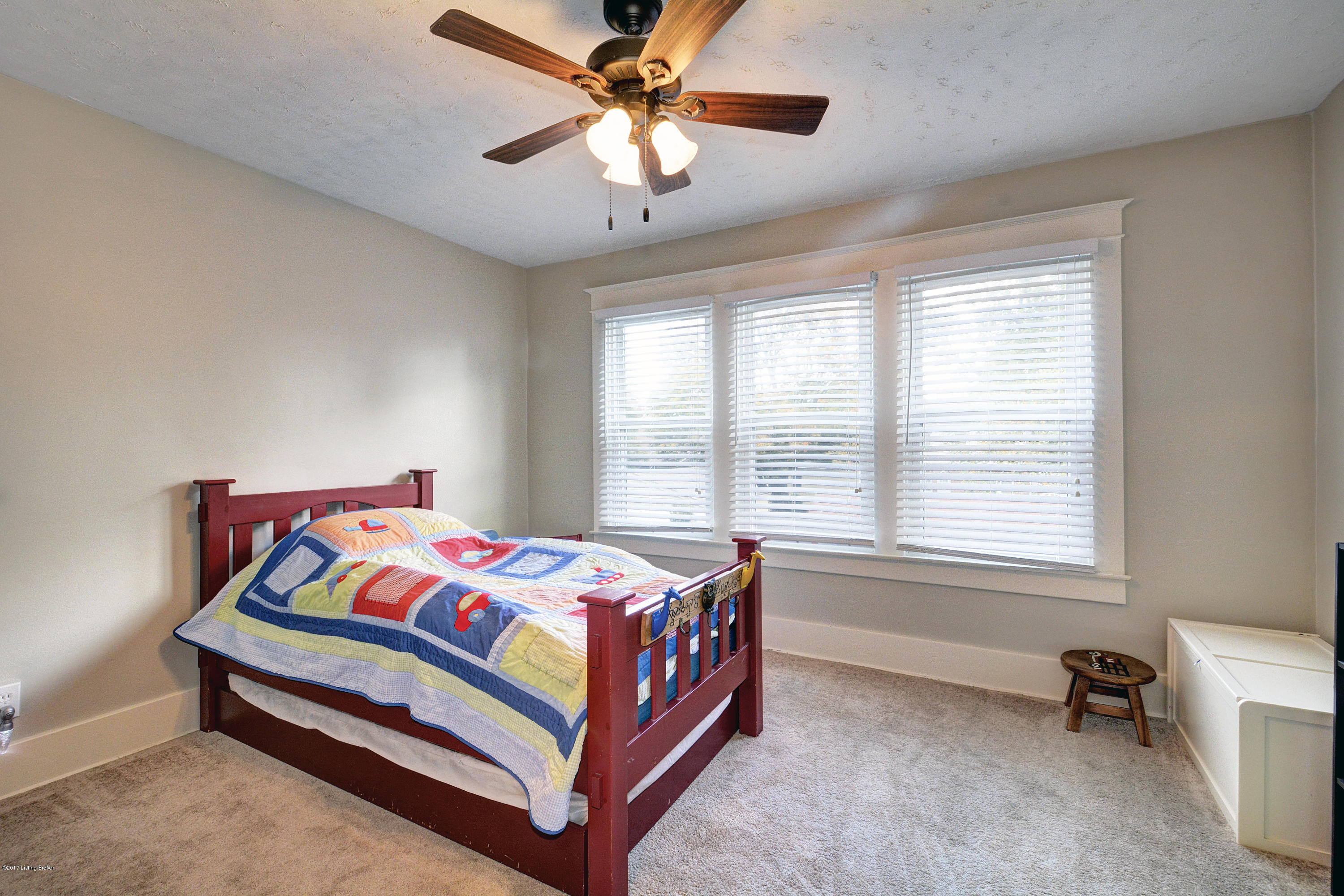 217 Iola Road Louisville, KY 40207 - Photo 26 of 44 The second upper level bedroom is detailed with large windows and a walk in closet.