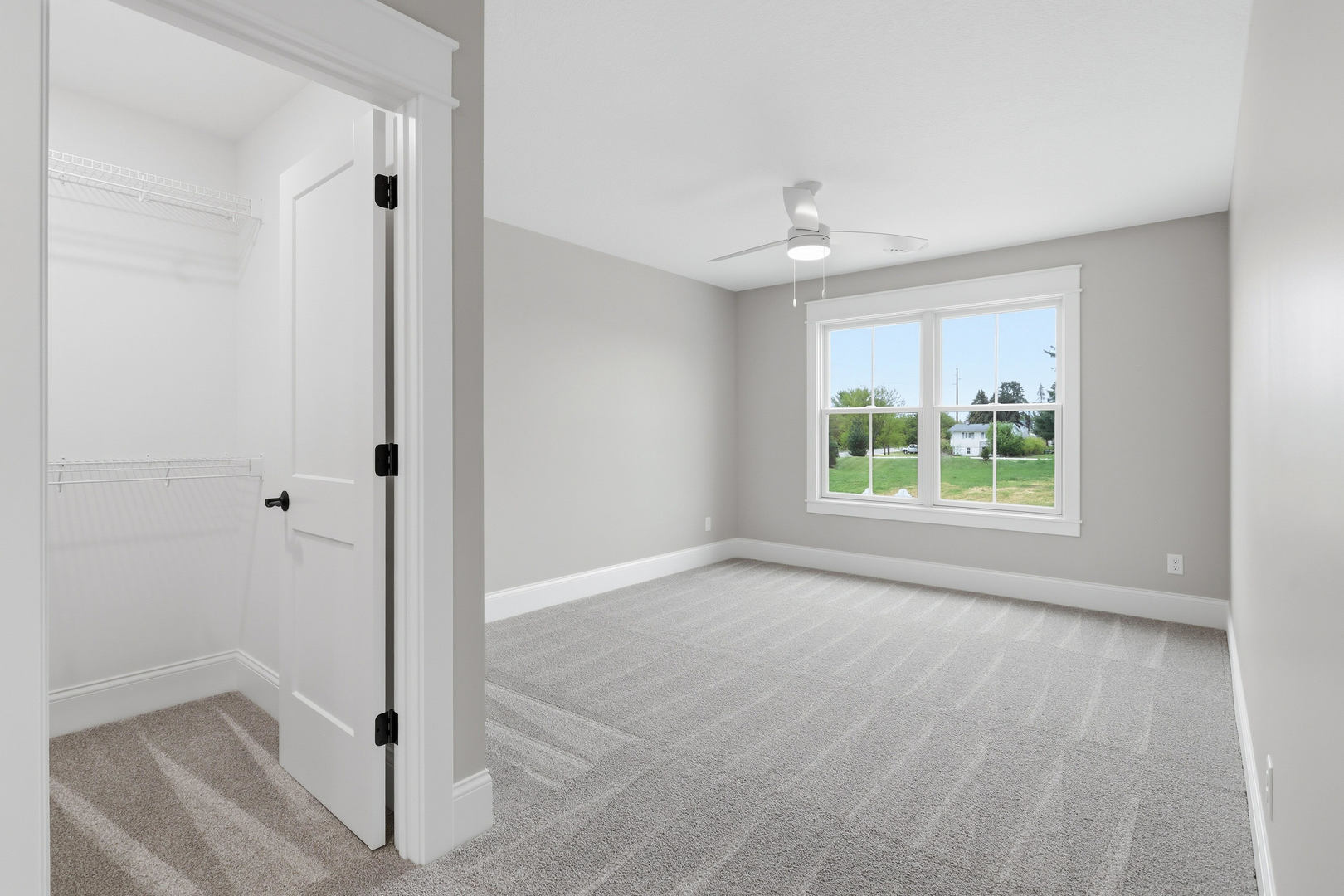 6928 Wilderness Pointe Bettendorf, IA 52722 - Photo 36 of 48 wooden floor in an empty room with a window
