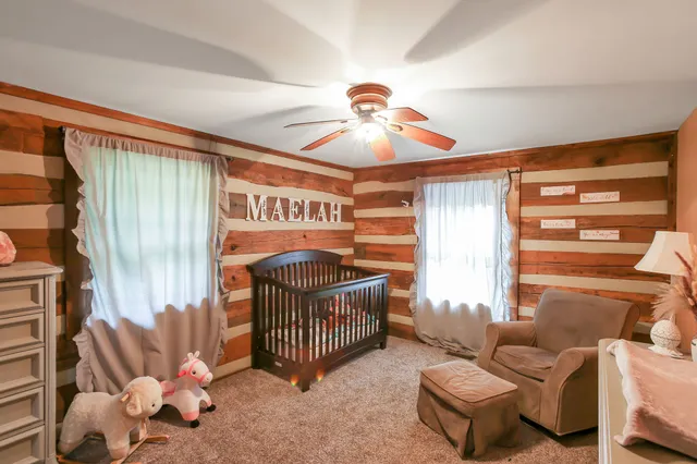 a bedroom with furniture and a window