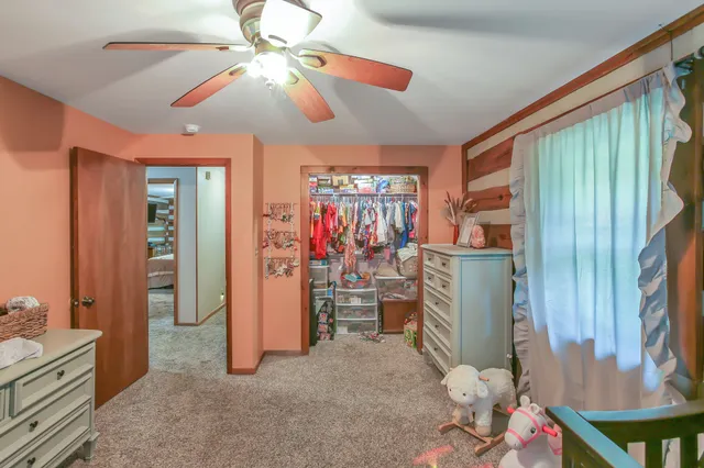 a view of a livingroom with furniture and workspace