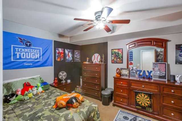 a bedroom with furniture and a chandelier