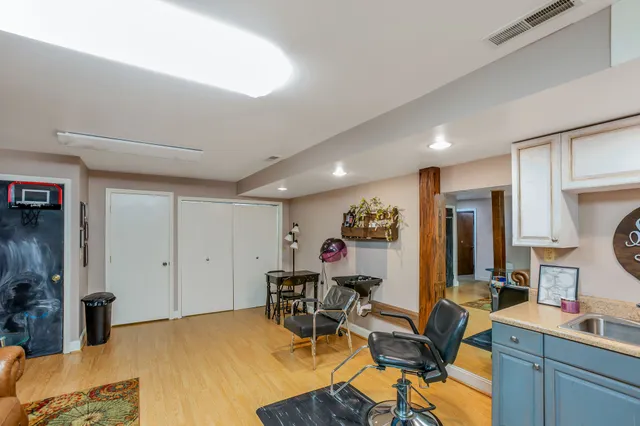 a view of a workspace with furniture