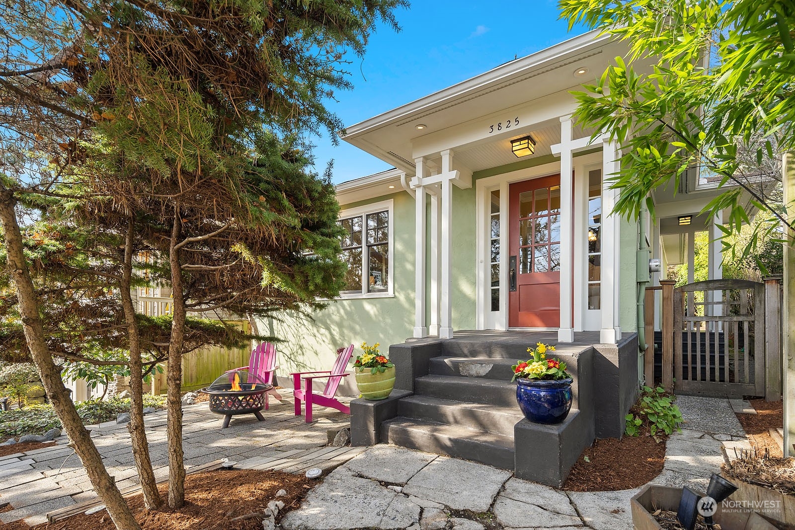 a front view of a house with outdoor seating