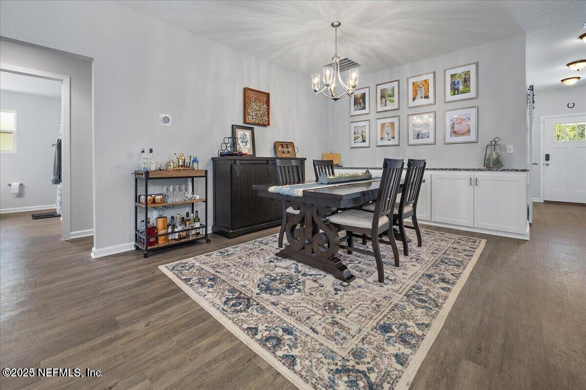 5573 Casavedra Court Jacksonville, FL 32244 - Photo 11 of 34 a living room with furniture and a wooden floor