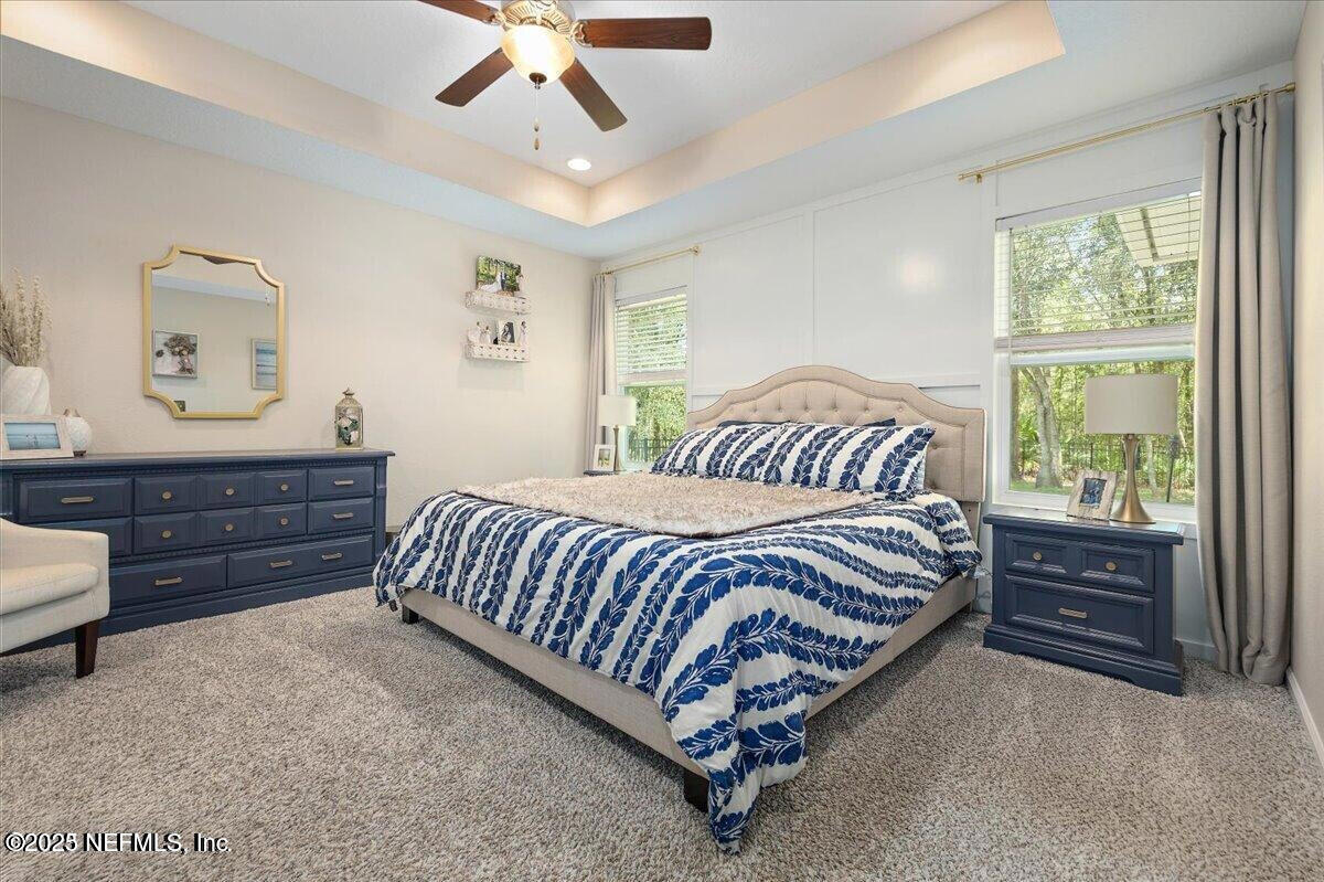 5573 Casavedra Court Jacksonville, FL 32244 - Photo 14 of 34 a bed sitting in a bedroom next to a window