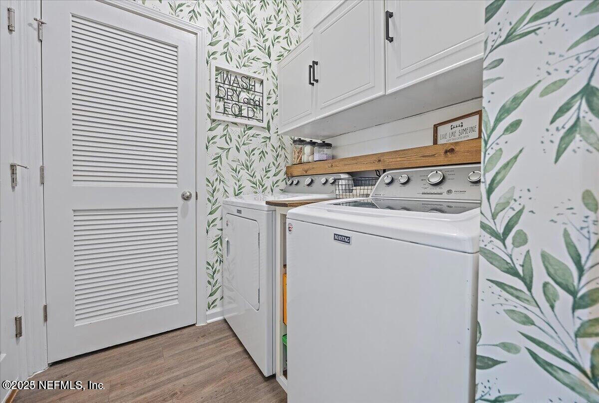 5573 Casavedra Court Jacksonville, FL 32244 - Photo 23 of 34 a utility room with dryer and washer