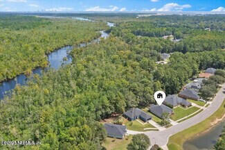 5573 Casavedra Court Jacksonville, FL 32244 - Photo 31 of 34 a view of a house with a yard