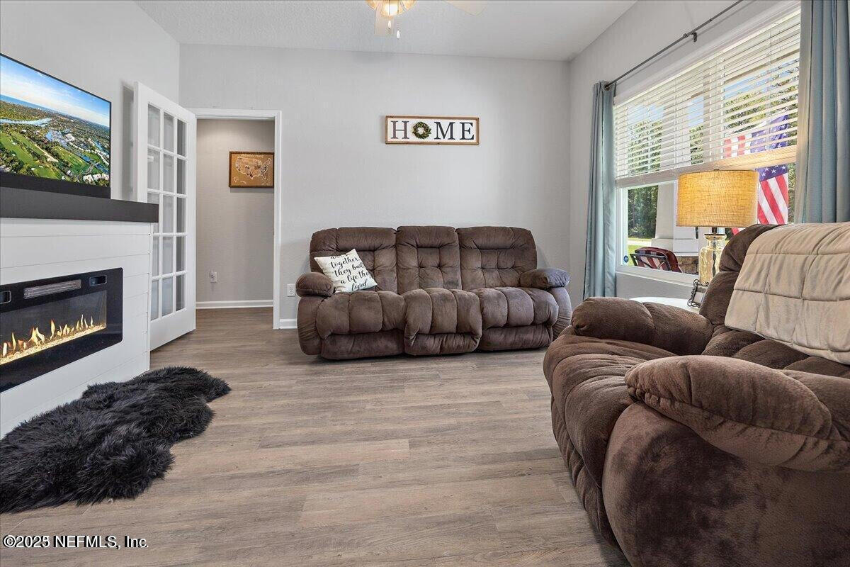 5573 Casavedra Court Jacksonville, FL 32244 - Photo 6 of 34 a living room with furniture and a fireplace