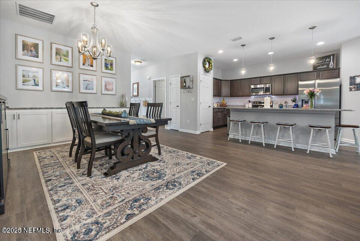 5573 Casavedra Court Jacksonville, FL 32244 - Photo 10 of 34 a view of a dining room with furniture