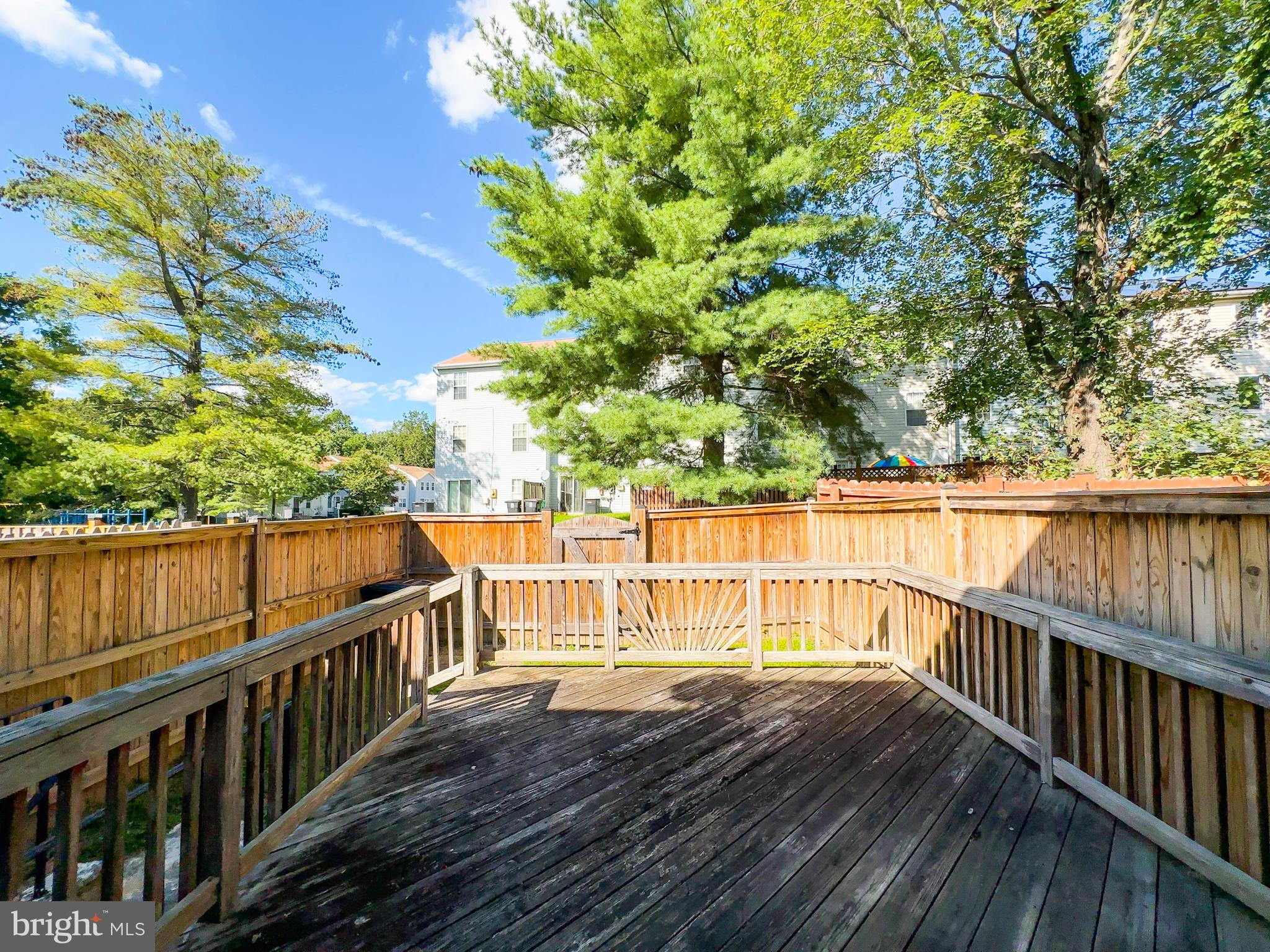 8578 Ritchboro Road District Heights, MD 20747 - Photo 10 of 31 a view of balcony with wooden floor and fence