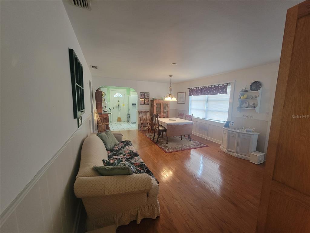 7 Wisconsin Avenue St. Cloud, FL 34769 - Photo 11 of 18 a living room with furniture and wooden floor