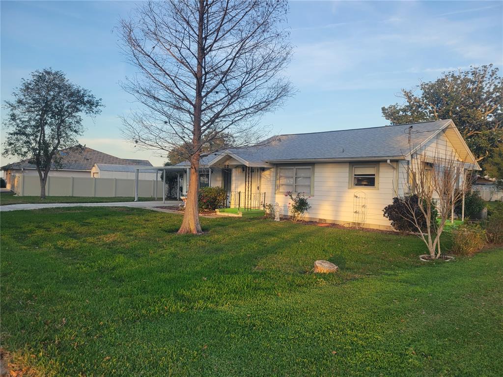 7 Wisconsin Avenue St. Cloud, FL 34769 - Photo 16 of 18 a front view of a house with a yard