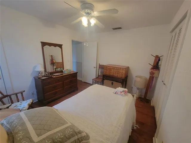 a bedroom with a bed and furniture