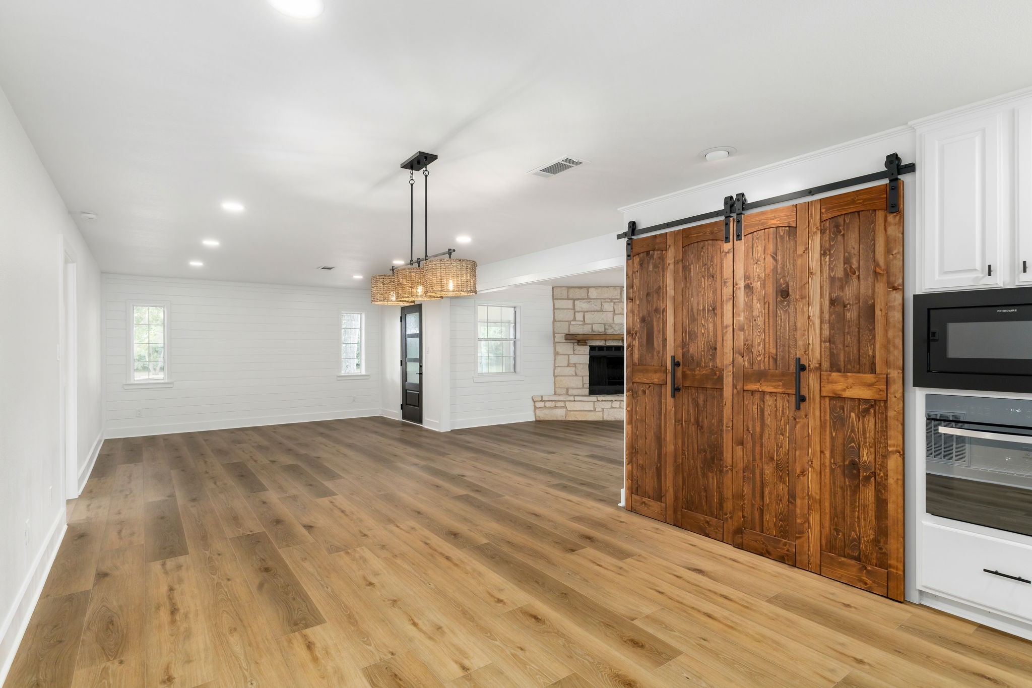 1195 Track Road New Ulm, TX 78950 - Photo 14 of 49 a view of a kitchen with a refrigerator and a stove top oven