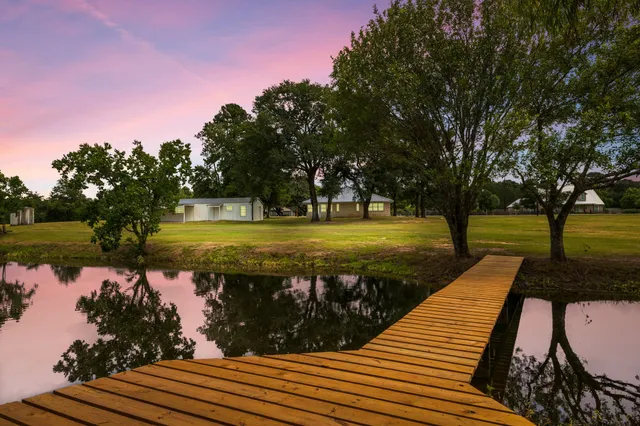 a view of a lake with a garden