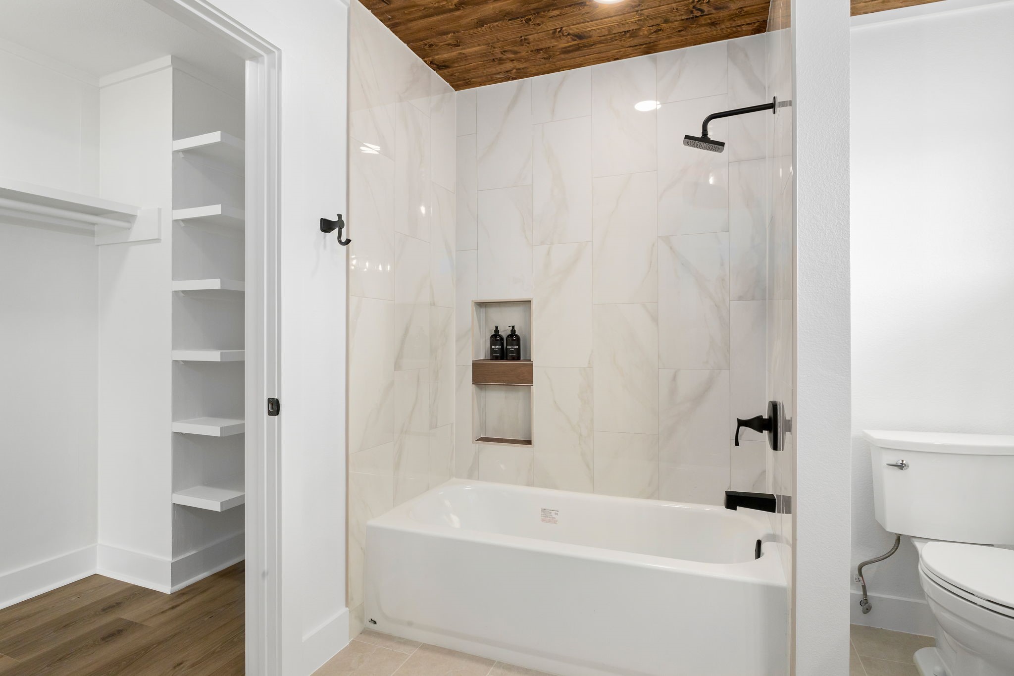 1195 Track Road New Ulm, TX 78950 - Photo 23 of 49 a bathroom with a bathtub a toilet and a shower