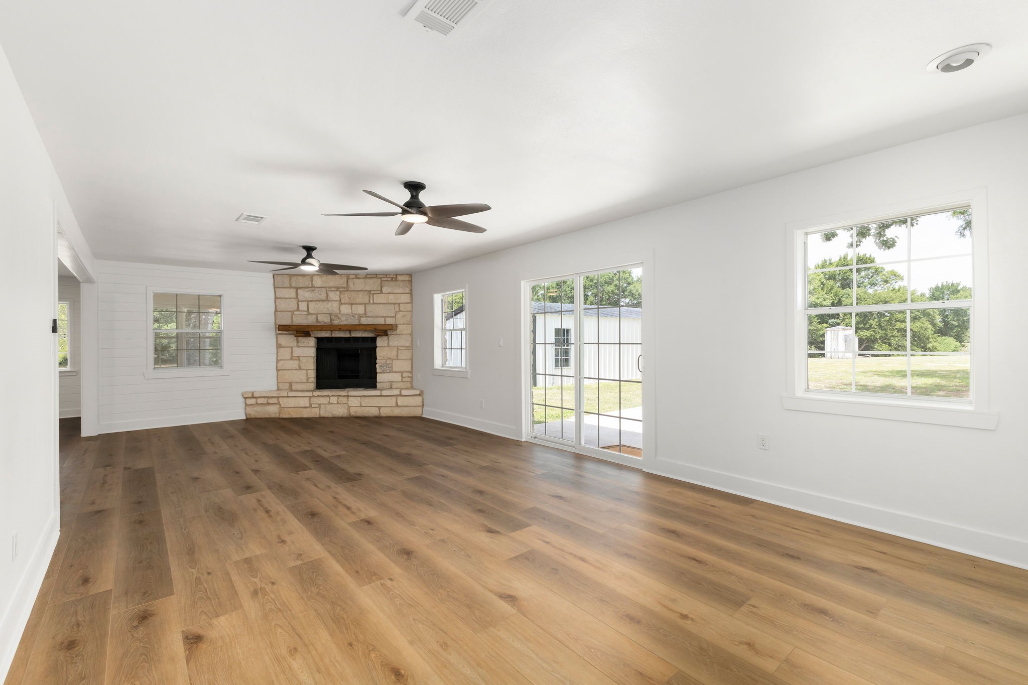1195 Track Road New Ulm, TX 78950 - Photo 26 of 49 a view of an empty room with a window and fireplace