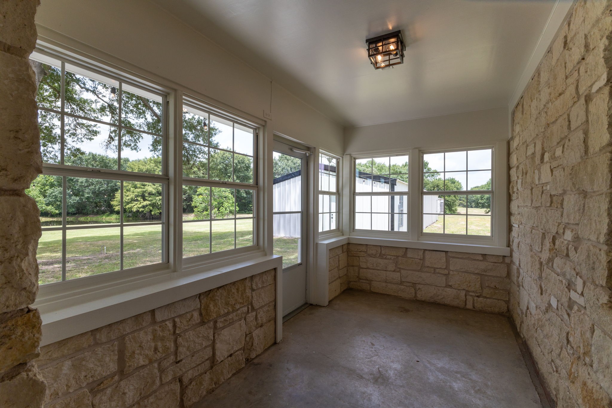 1195 Track Road New Ulm, TX 78950 - Photo 35 of 49 wooden floor in an empty room with a large window