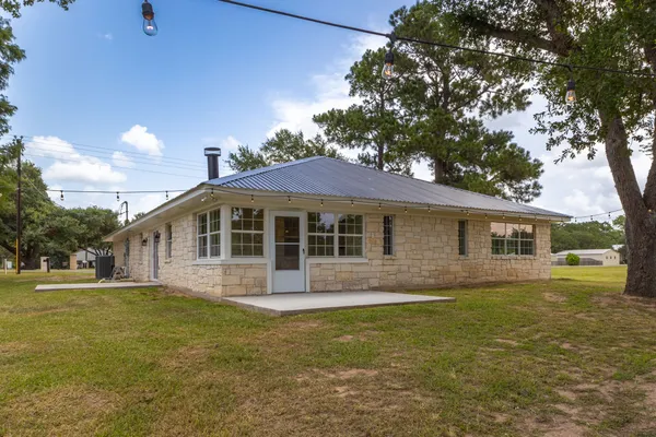a view of a house with a big yard
