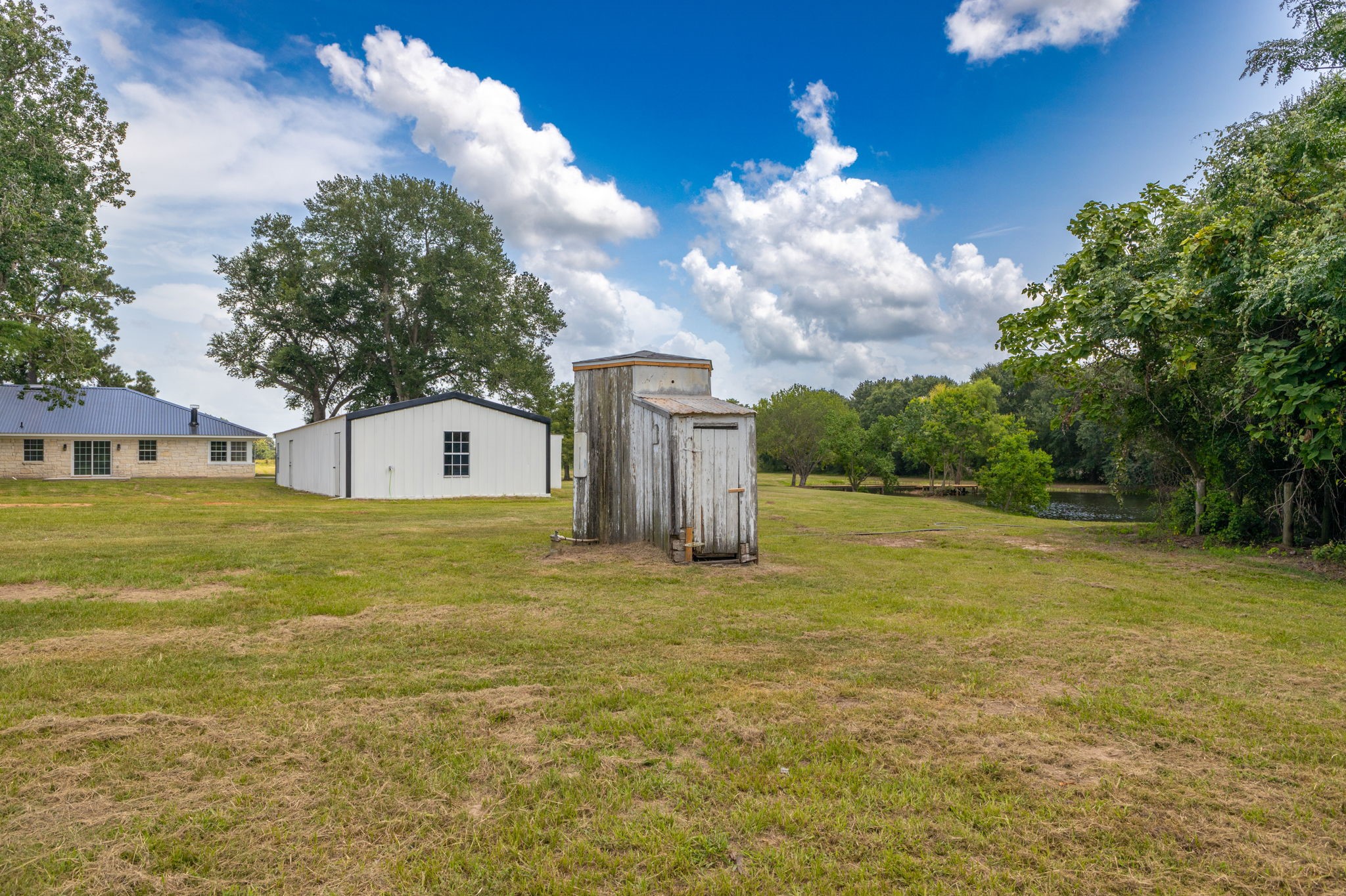 1195 Track Road New Ulm, TX 78950 - Photo 42 of 49 a house view with swimming pool in front of it