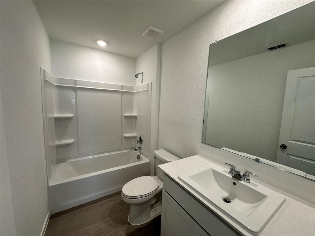 1613 Elliott Road Howe, TX 75459 - Photo 12 of 13 a bathroom with a sink a toilet and shower