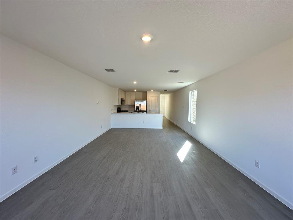 1613 Elliott Road Howe, TX 75459 - Photo 2 of 13 a view of a room with wooden floor