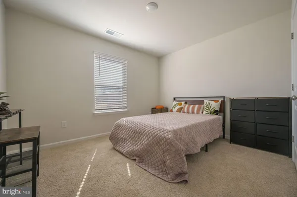 a bedroom with a bed and a closet