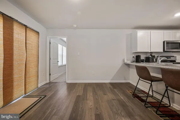 a kitchen with sink and cabinets