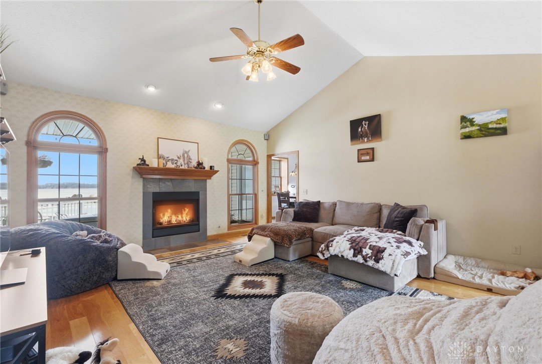 1540 Jasper Road Xenia, OH 45385 - Photo 14 of 91 This living room features high ceilings and a cozy fireplace, perfect for relaxation.