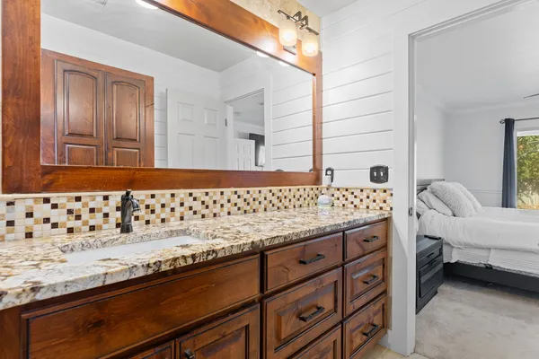 a bathroom with a sink and a mirror