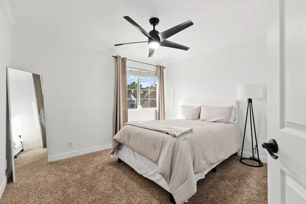 a bedroom with a bed and cabinets