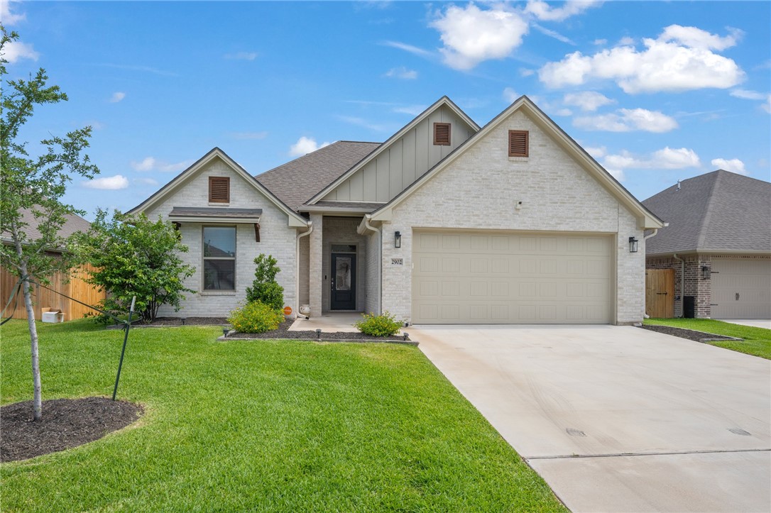 2902 Captain Court Bryan, TX 77808 - Photo 1 of 1 a front view of a house with a yard and garage