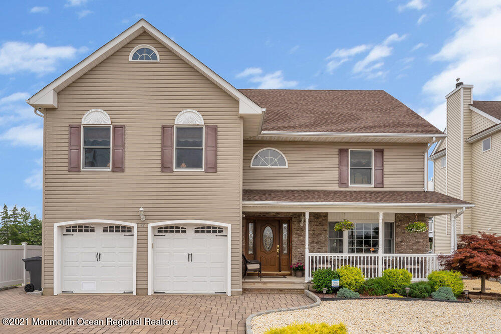 37 Channel Road Toms River, NJ 08753 - Photo 1 of 57 a view of a white house with large windows