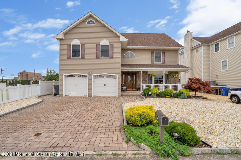 37 Channel Road Toms River, NJ 08753 - Photo 3 of 57 a front view of a house with a yard and garage