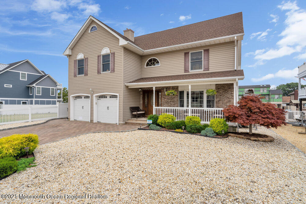 37 Channel Road Toms River, NJ 08753 - Photo 4 of 57 a front view of a house with garden