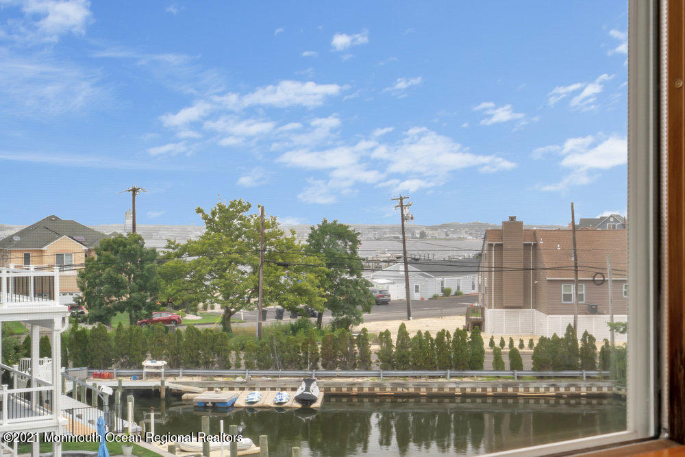 37 Channel Road Toms River, NJ 08753 - Photo 44 of 57 a view of a lake with a city
