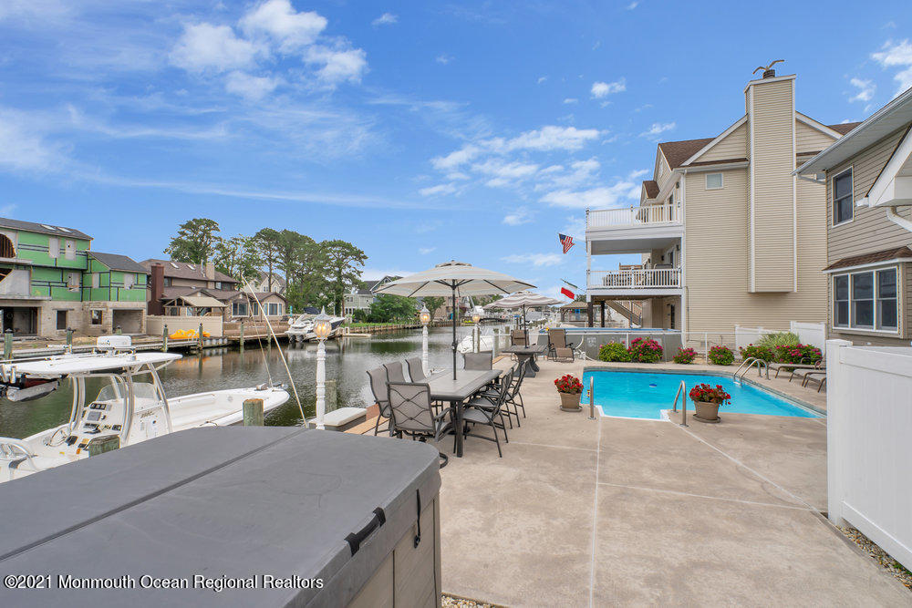37 Channel Road Toms River, NJ 08753 - Photo 45 of 57 a view of a lake with a table and chairs