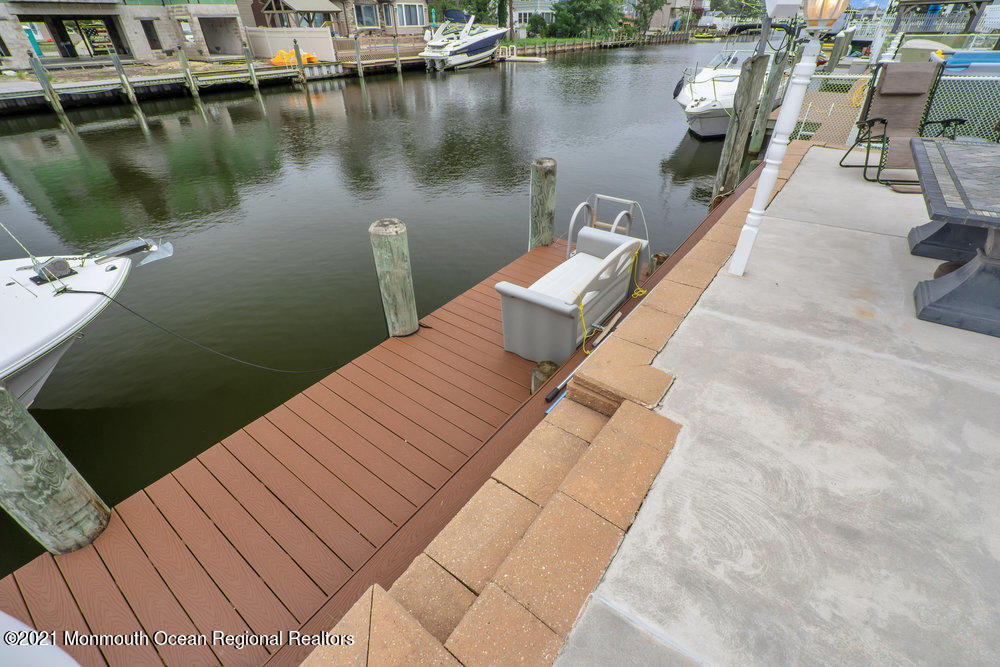 37 Channel Road Toms River, NJ 08753 - Photo 50 of 57 a view of a lake with outdoor seating