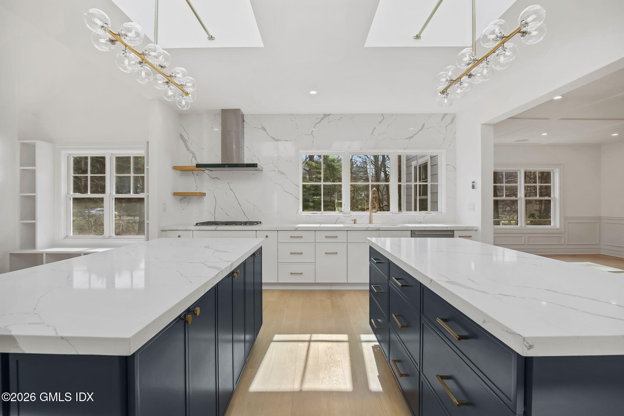 7 Bailiwick Road Greenwich, CT 06831 - Photo 15 of 42 a kitchen with stainless steel appliances granite countertop a sink stove and cabinets