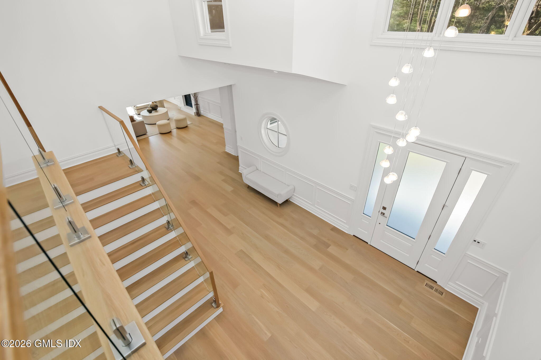 7 Bailiwick Road Greenwich, CT 06831 - Photo 17 of 42 a view of a livingroom with wooden floor and stairs