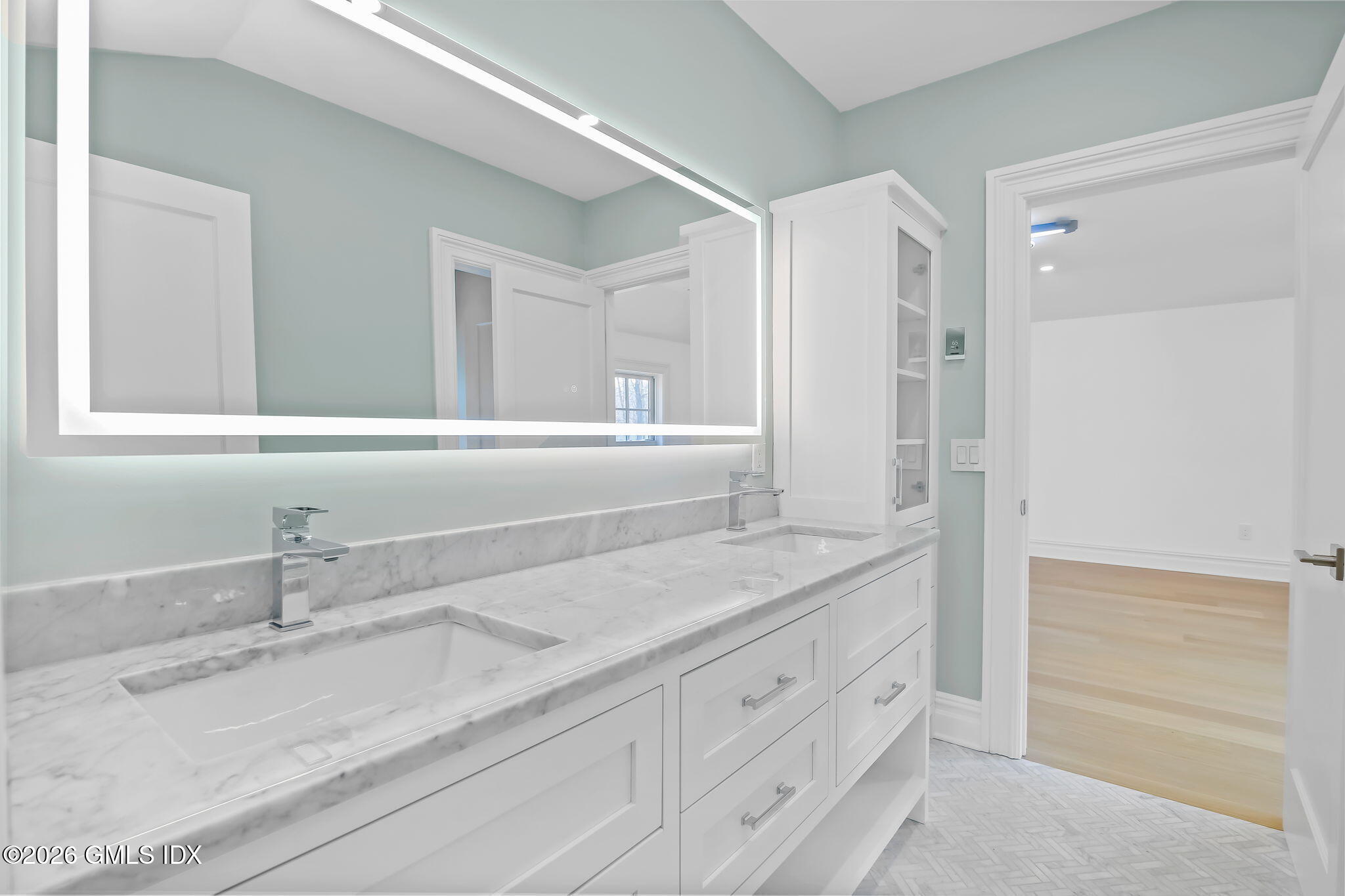 7 Bailiwick Road Greenwich, CT 06831 - Photo 28 of 42 a bathroom with a granite countertop sink and a mirror