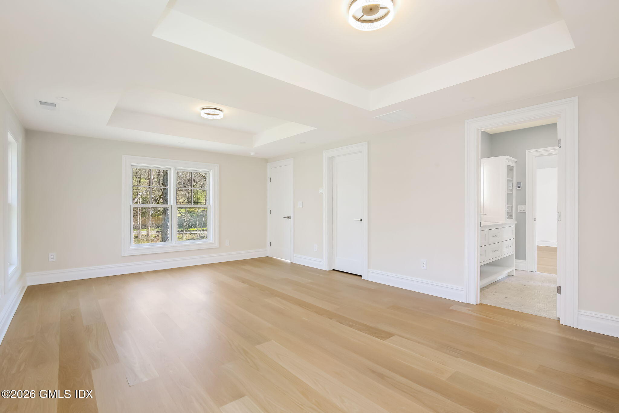 7 Bailiwick Road Greenwich, CT 06831 - Photo 29 of 42 a view of an empty room with wooden floor and a window