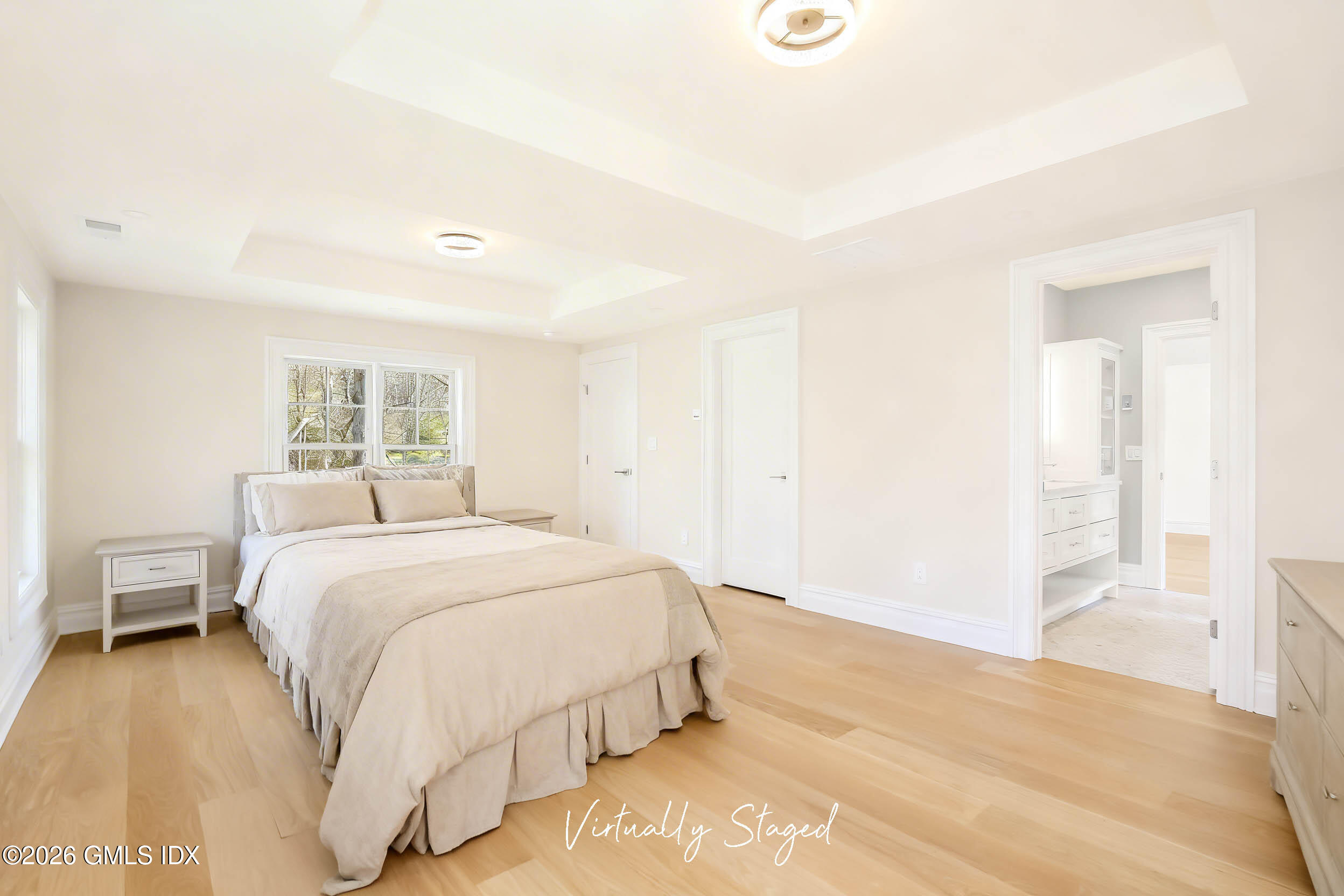 7 Bailiwick Road Greenwich, CT 06831 - Photo 30 of 42 a bedroom with a bed and a painting