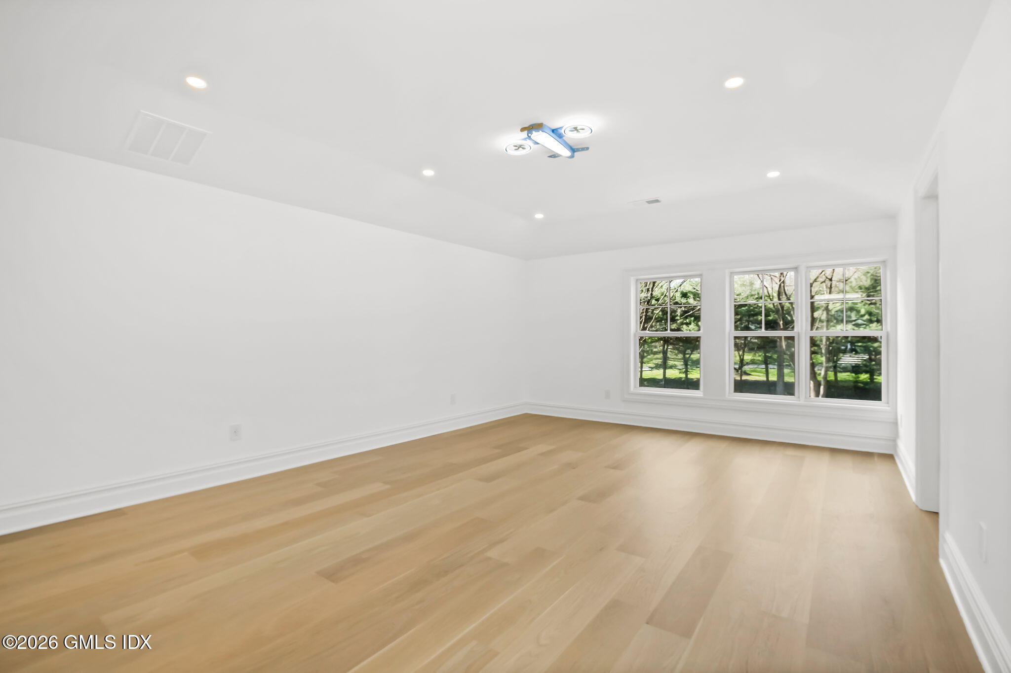 7 Bailiwick Road Greenwich, CT 06831 - Photo 31 of 42 wooden floor in an empty room with a window