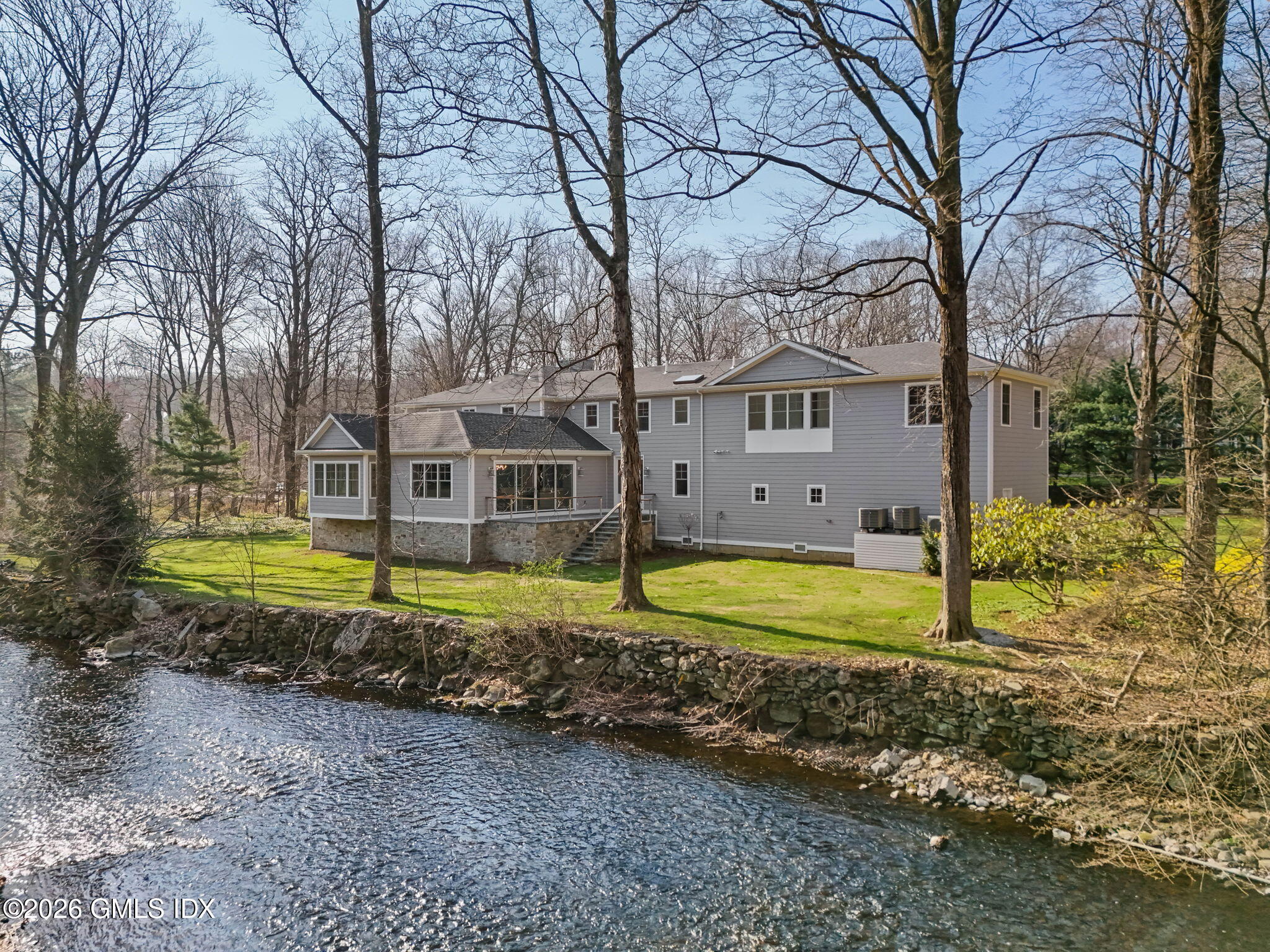 7 Bailiwick Road Greenwich, CT 06831 - Photo 36 of 42 a view of a house with a yard and large tree